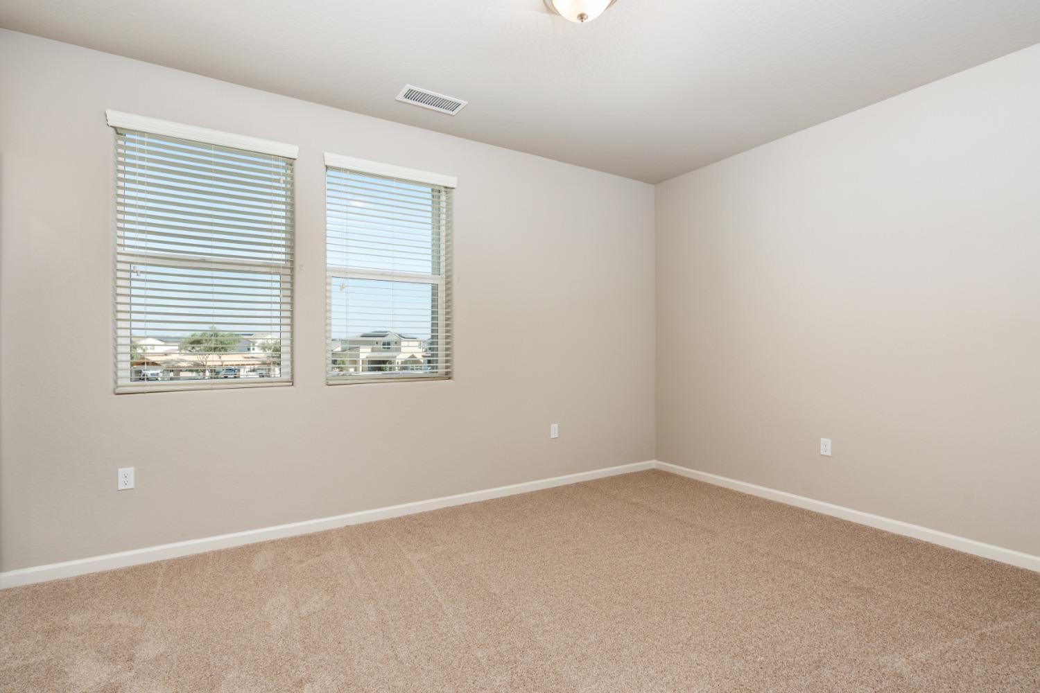 952 Pinnacle Drive Madera, CA 93636 - Photo 29 of 32 an empty room with a window