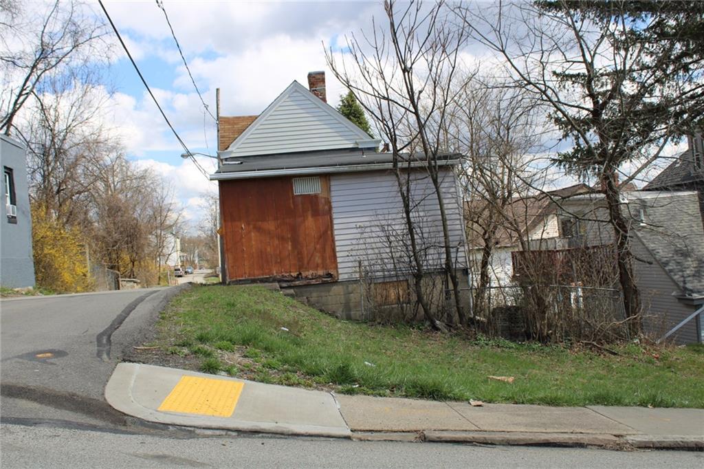 2206 Elsie Street Pittsburgh, PA 15210 - Photo 2 of 11 a front view of a house with a yard