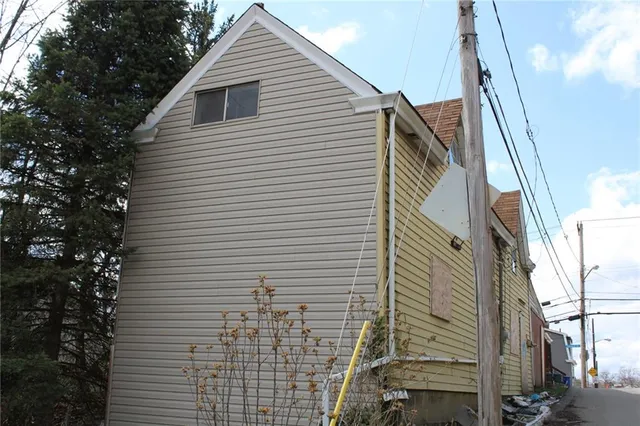 a view of a house with a street