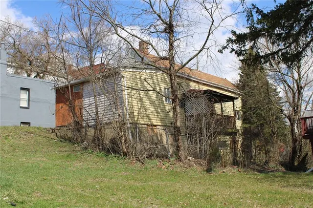 a view of a backyard of the house