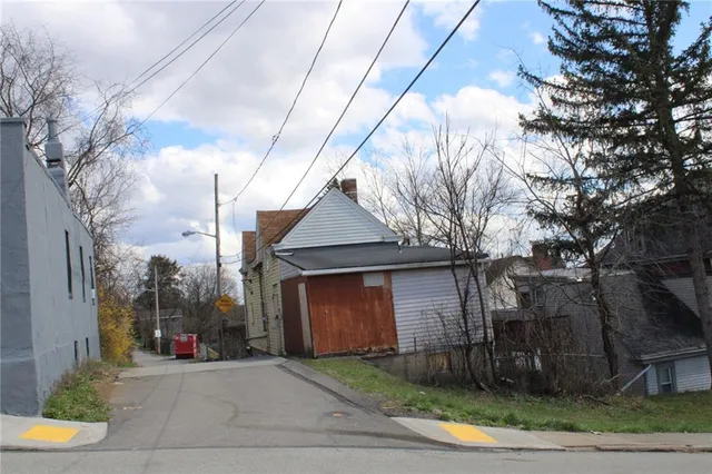 a view of a house with a street