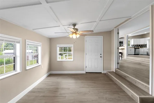 a view of an empty room with a window