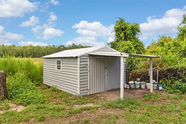 a building with trees in the background