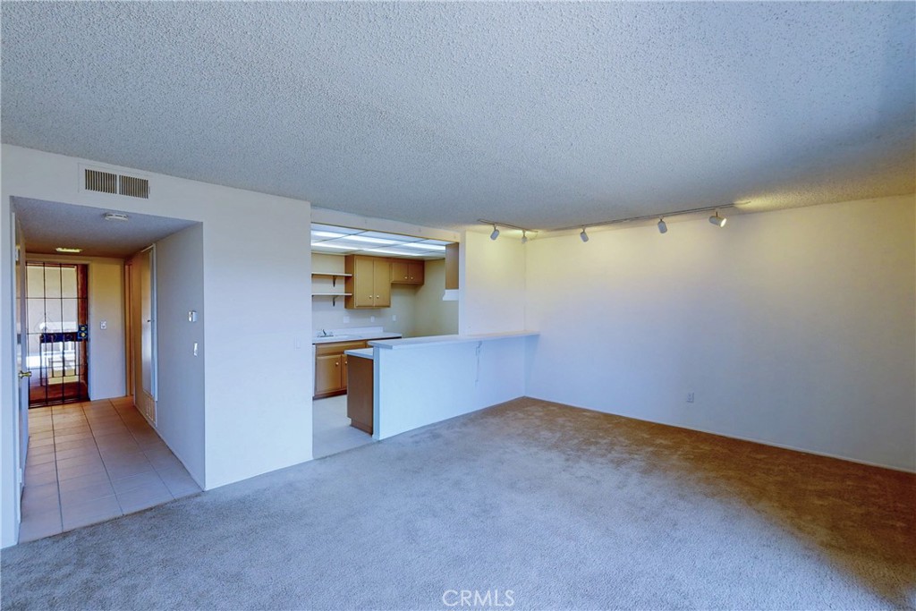 6600 Warner Avenue, Unit 88 Huntington Beach, CA 92647 - Photo 1 of 25 a view of an empty room with a window