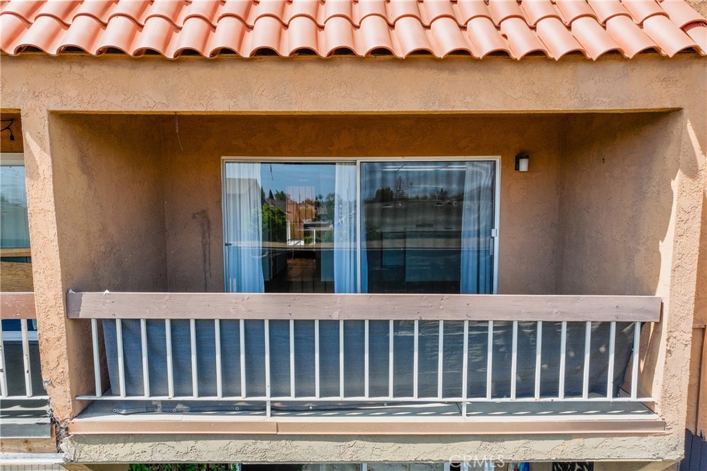 6600 Warner Avenue, Unit 88 Huntington Beach, CA 92647 - Photo 13 of 25 a view of a house with a door and a yard