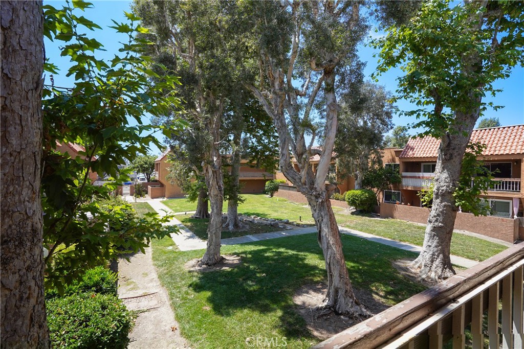 6600 Warner Avenue, Unit 88 Huntington Beach, CA 92647 - Photo 21 of 25 a view of a garden with large trees