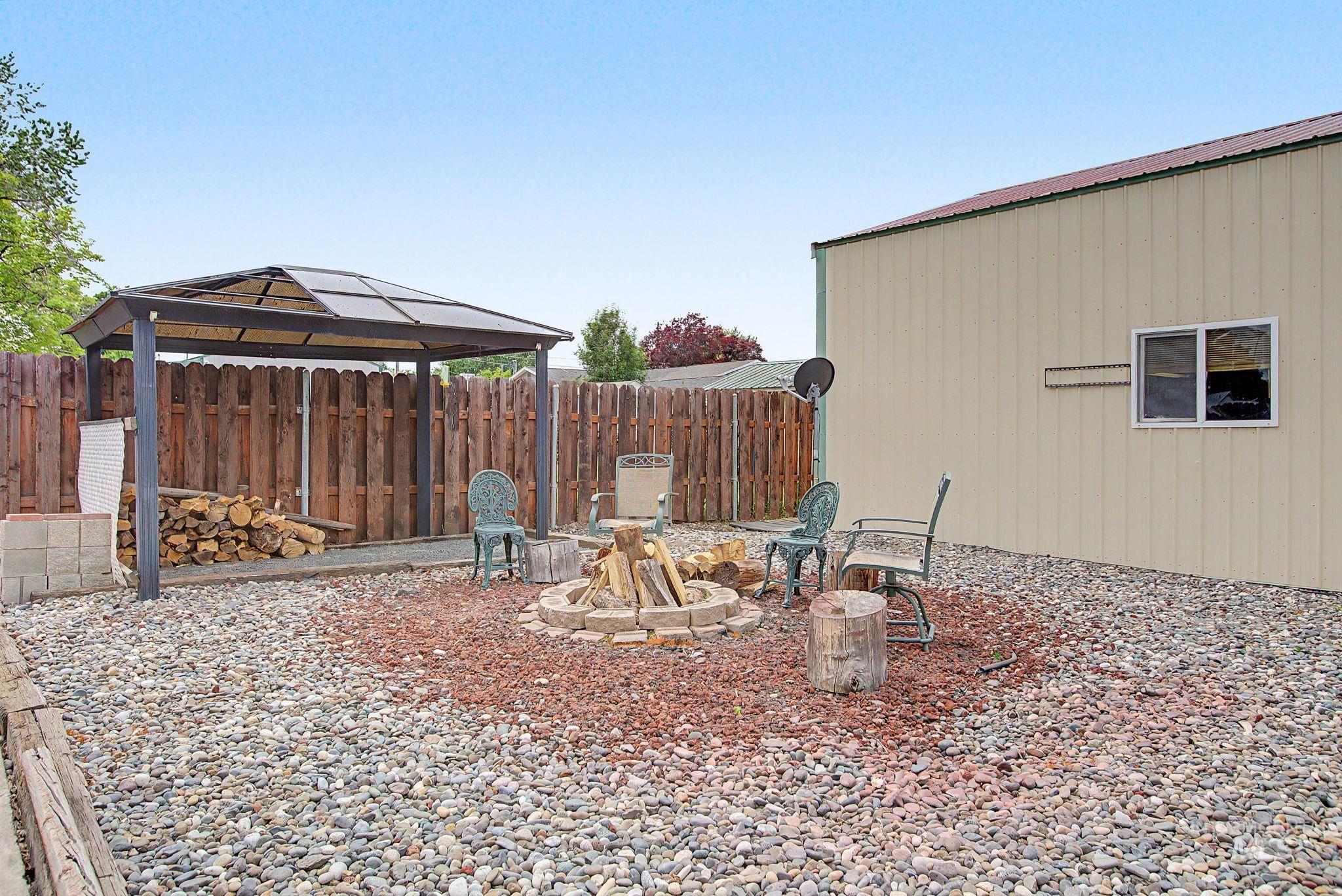 3314 6th Street Lewiston, ID 83501 - Photo 43 of 50 Exterior space featuring a gravel ground cover and a stone fire pit