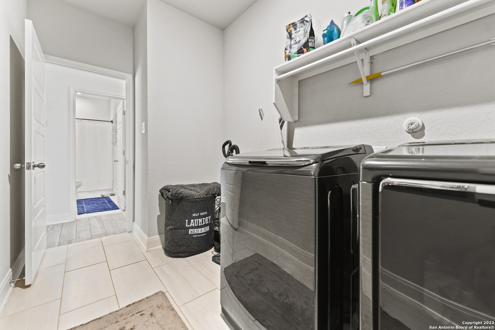 12136 Icon Ridge San Antonio, TX 78253 - Photo 19 of 26 a utility room with dryer and washer