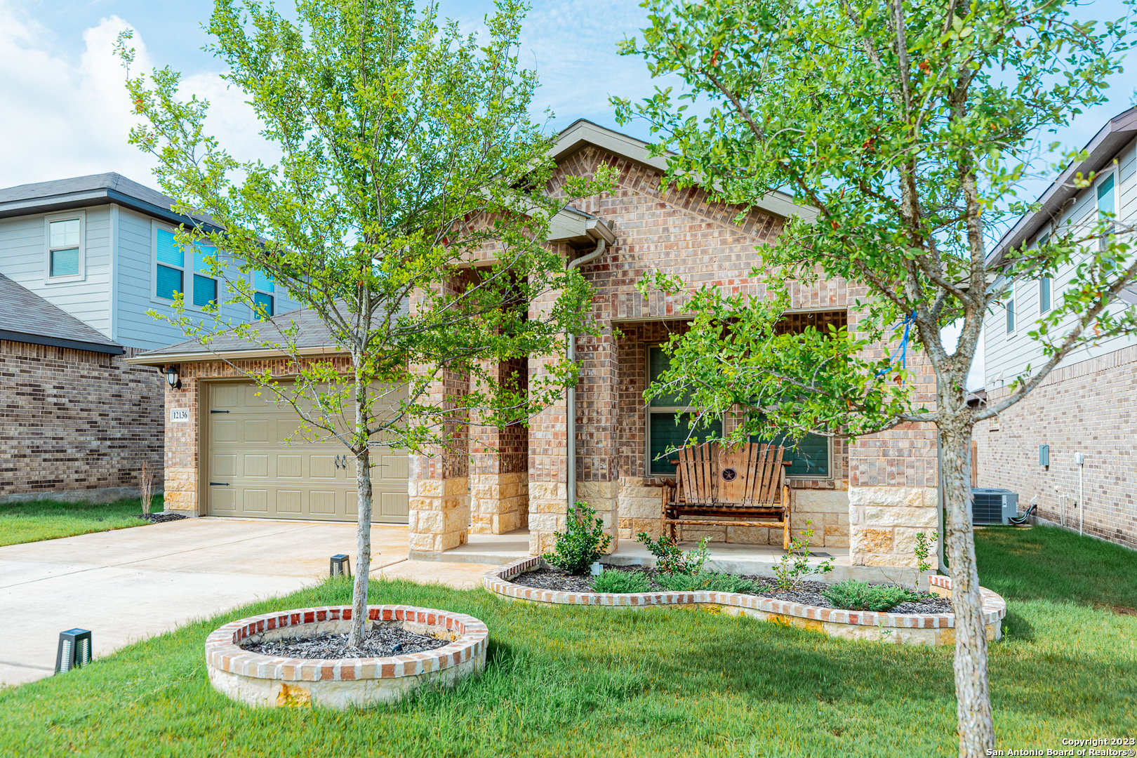 12136 Icon Ridge San Antonio, TX 78253 - Photo 2 of 26 a front view of a house with a yard