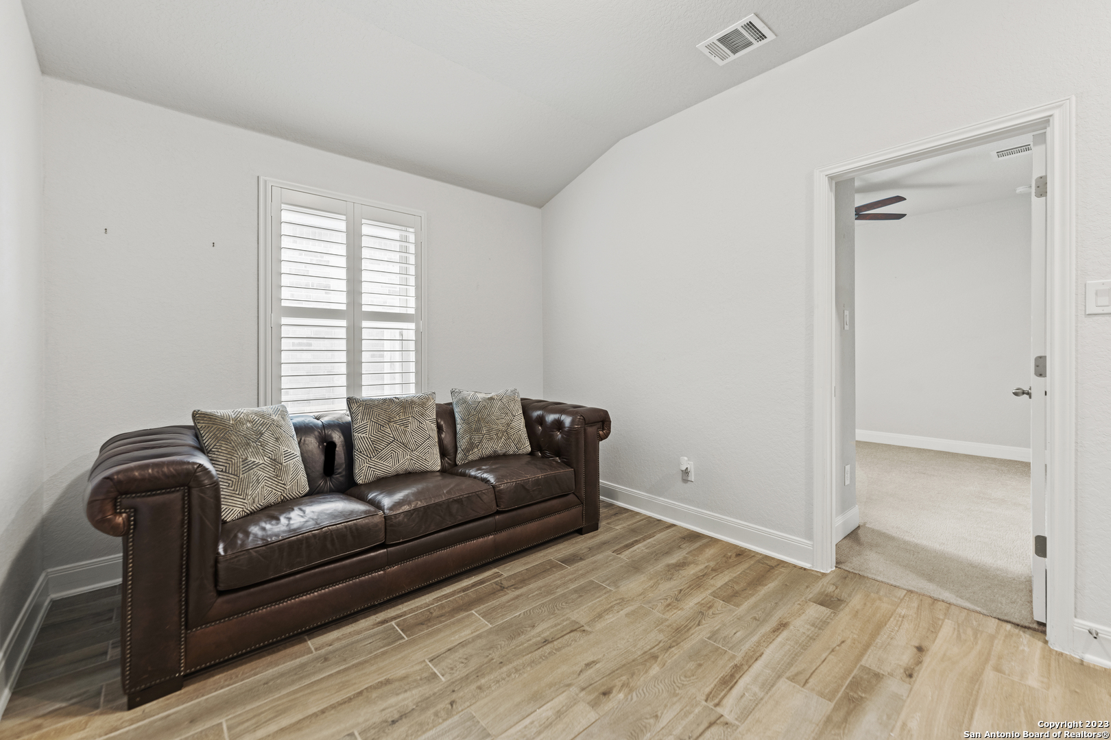 12136 Icon Ridge San Antonio, TX 78253 - Photo 21 of 26 a living room with furniture and wooden floor