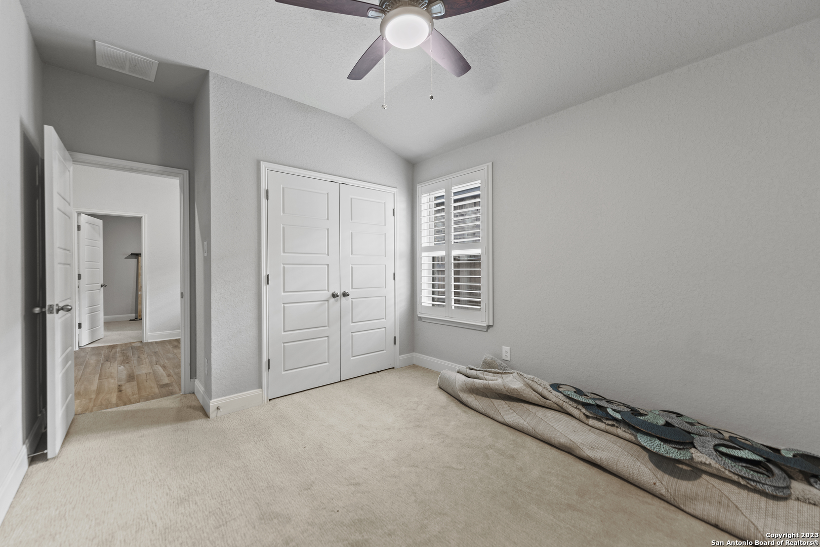 12136 Icon Ridge San Antonio, TX 78253 - Photo 22 of 26 wooden floor and chandelier fan in a room