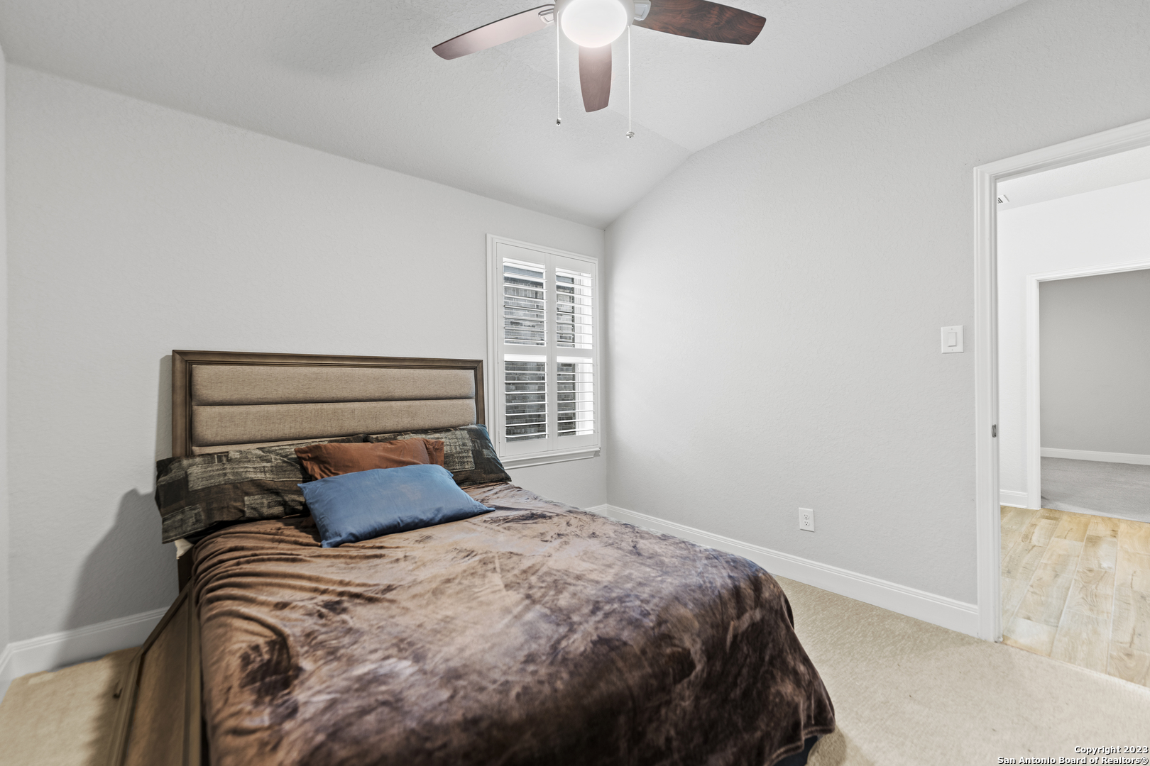 12136 Icon Ridge San Antonio, TX 78253 - Photo 23 of 26 a bedroom with a bed and window