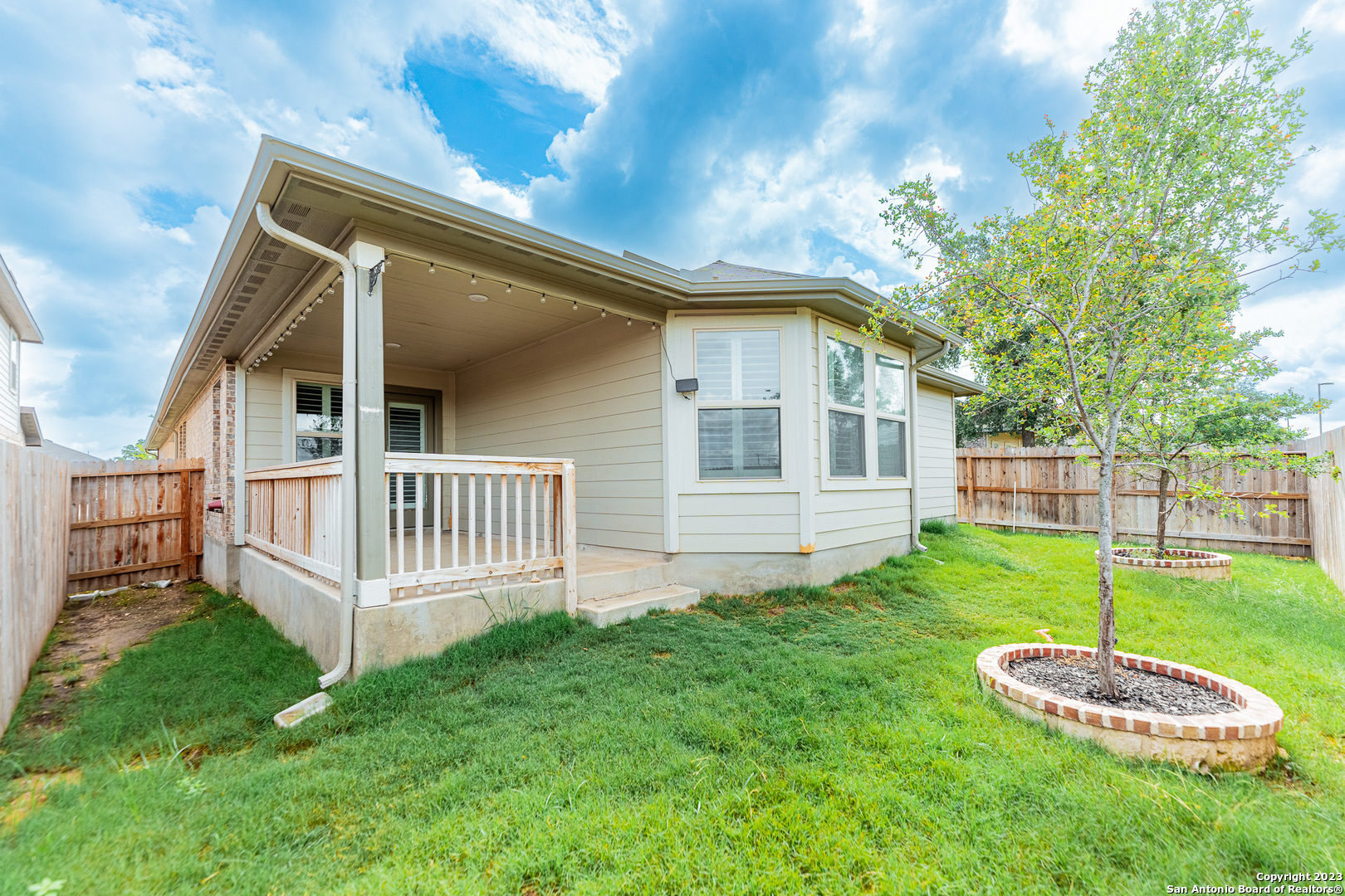 12136 Icon Ridge San Antonio, TX 78253 - Photo 26 of 26 a front view of a house with a yard