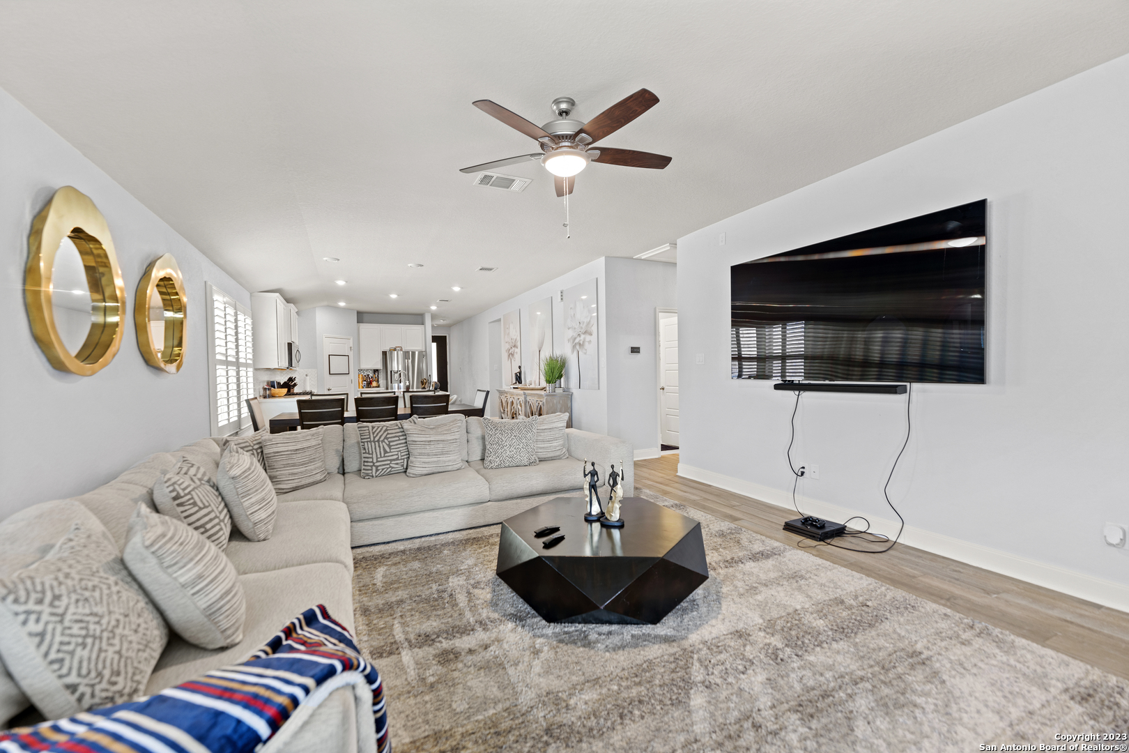 12136 Icon Ridge San Antonio, TX 78253 - Photo 9 of 26 a living room with furniture and a flat screen tv