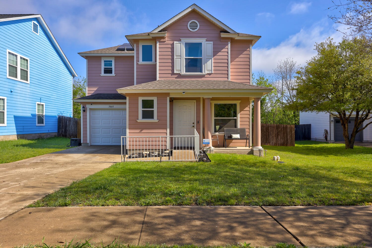 7005 Alegre Pass Austin, TX 78744 - Photo 1 of 1 a front view of a house with a yard