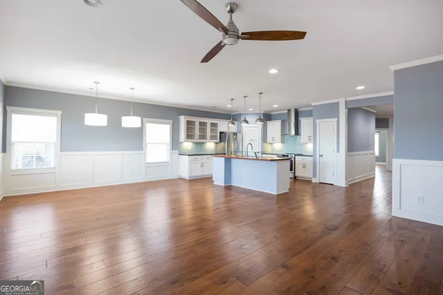 a view of kitchen with cabinets and wooden floor