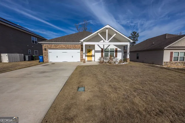 a front view of a house with a yard
