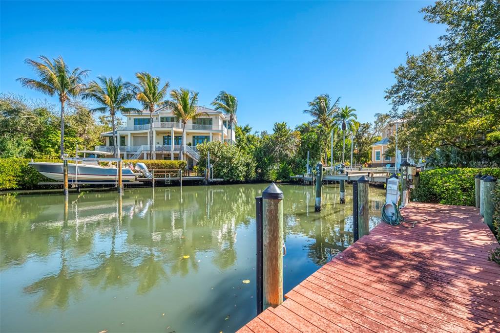 5303 Hidden Harbor Road Sarasota, FL 34242 - Photo 55 of 72 a view of residential house with outdoor space and lake view