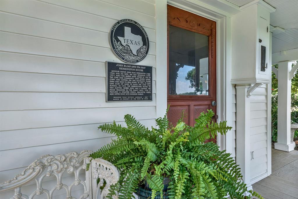 1425 Lone Star Road Celina, TX 75009 - Photo 40 of 40 A designated Texas Historic Landmark, the John Elias and Ida May Herrington House is recognized for its historical significance and enduring craftsmanship. The official historical marker highlights the home's rich heritage, while the welcoming front porch and original entry door offer a glimpse into the property's timeless character and well-preserved architectural details.