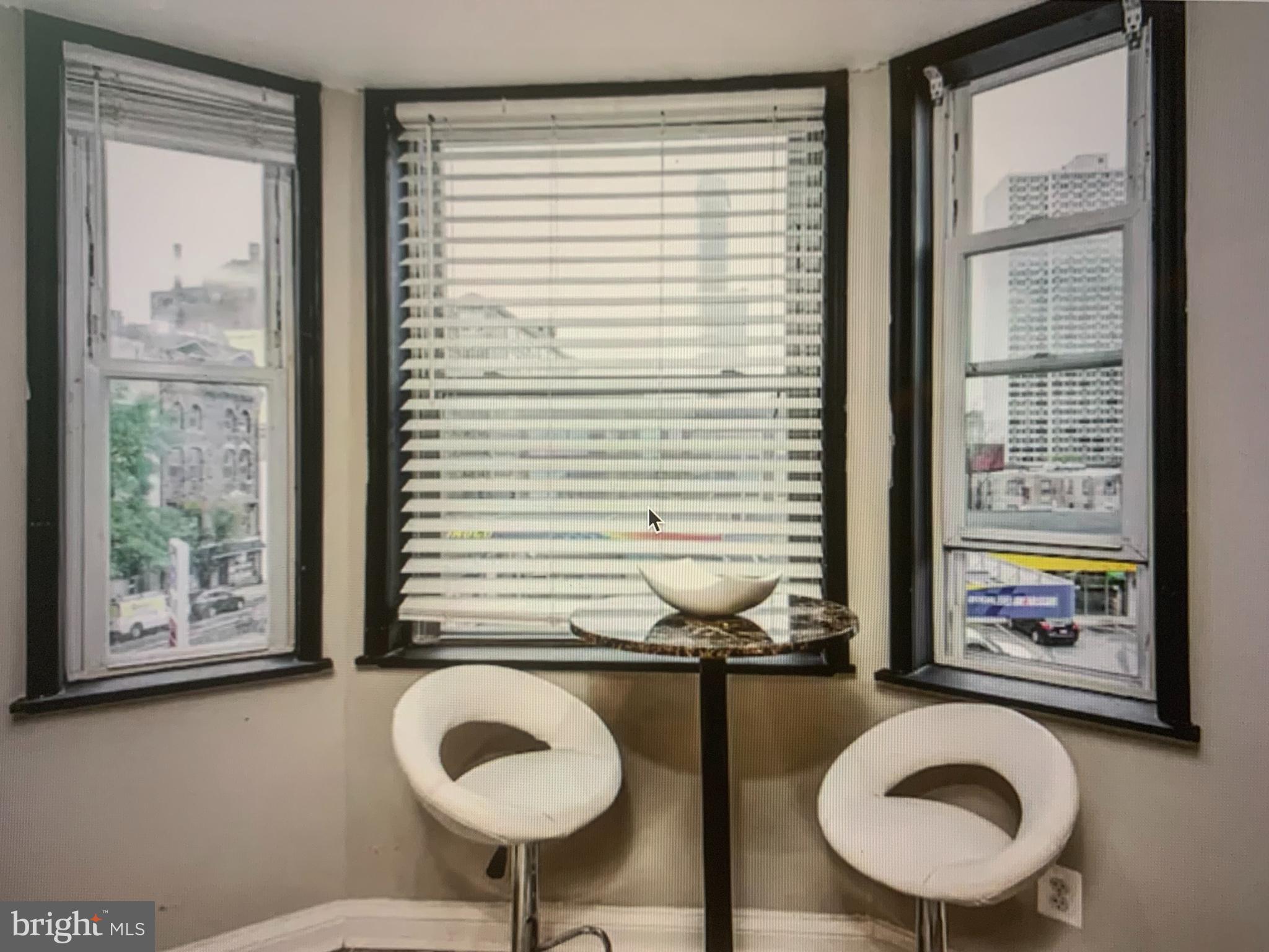 2135 Walnut Street, Unit 901 Philadelphia, PA 19103 - Photo 6 of 8 a bathroom with a toilet a sink and a window