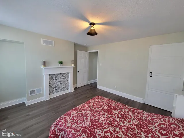 a living room with a couch and a fireplace