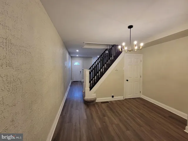 a view of entryway with wooden floor