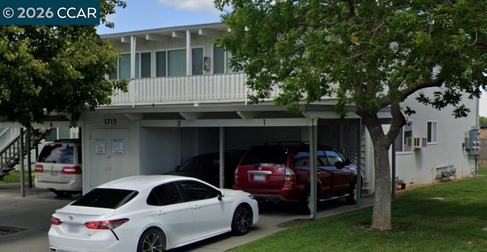 1712 Fillmore Street Fairfield, CA 94533 - Photo 2 of 3 a car parked in front of white house