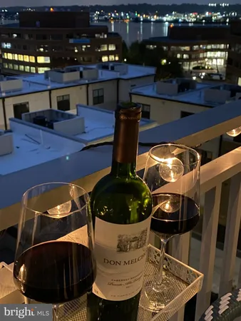 a table with wine bottles and glasses on it