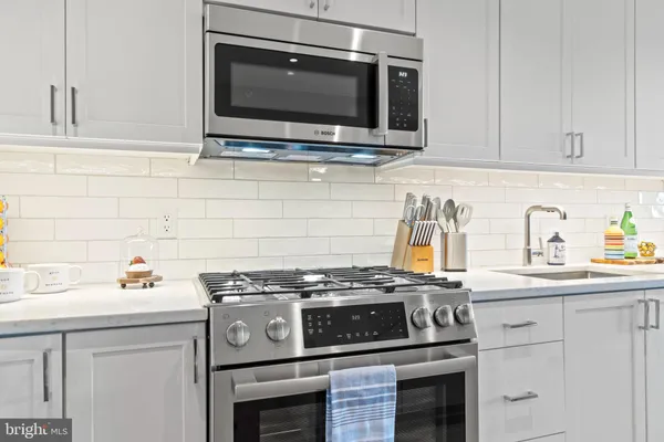 a kitchen with a stove and a microwave