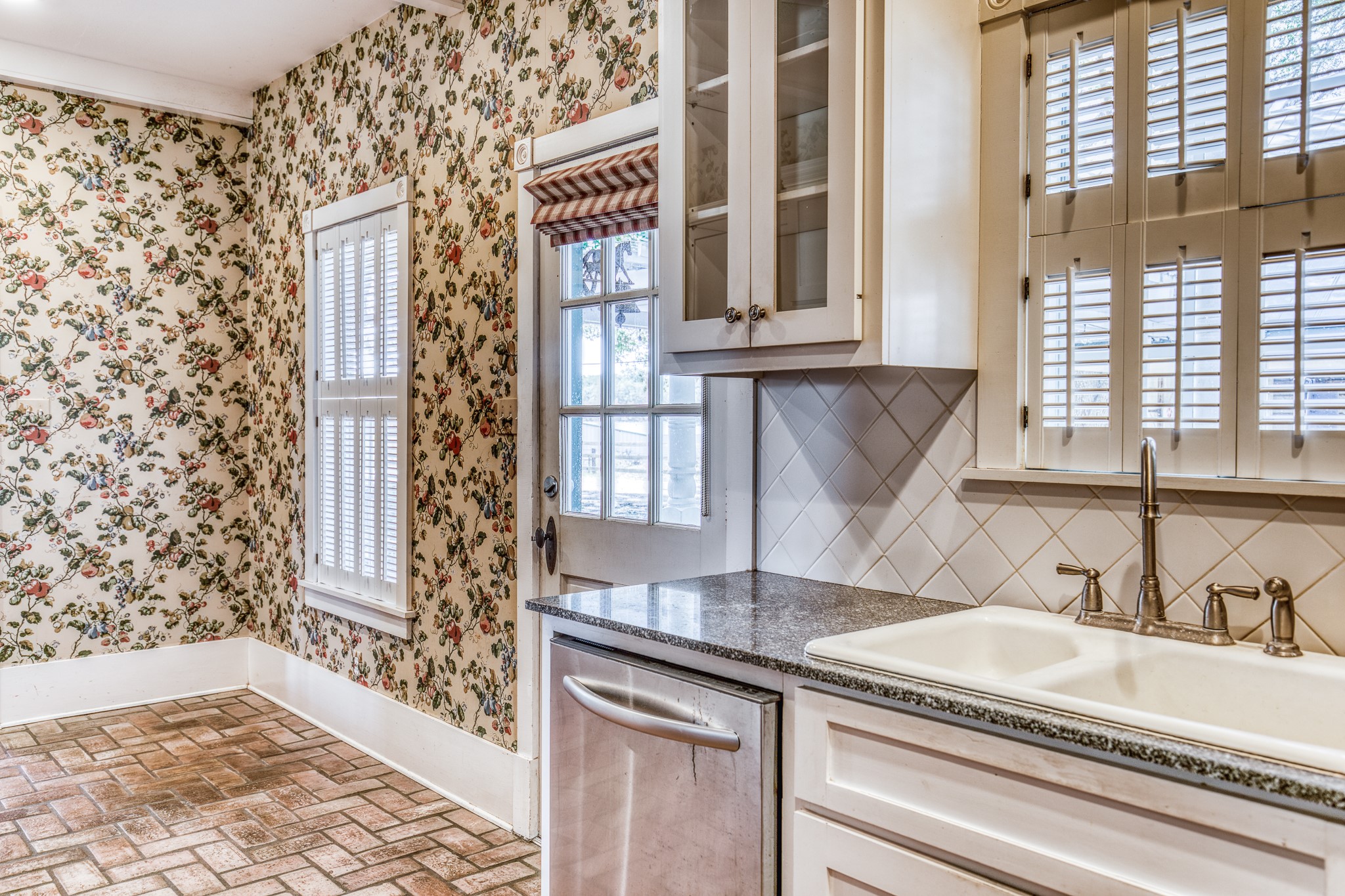 1712 Lynn Road Chappell Hill, TX 77426 - Photo 14 of 44 a kitchen with a sink and a window