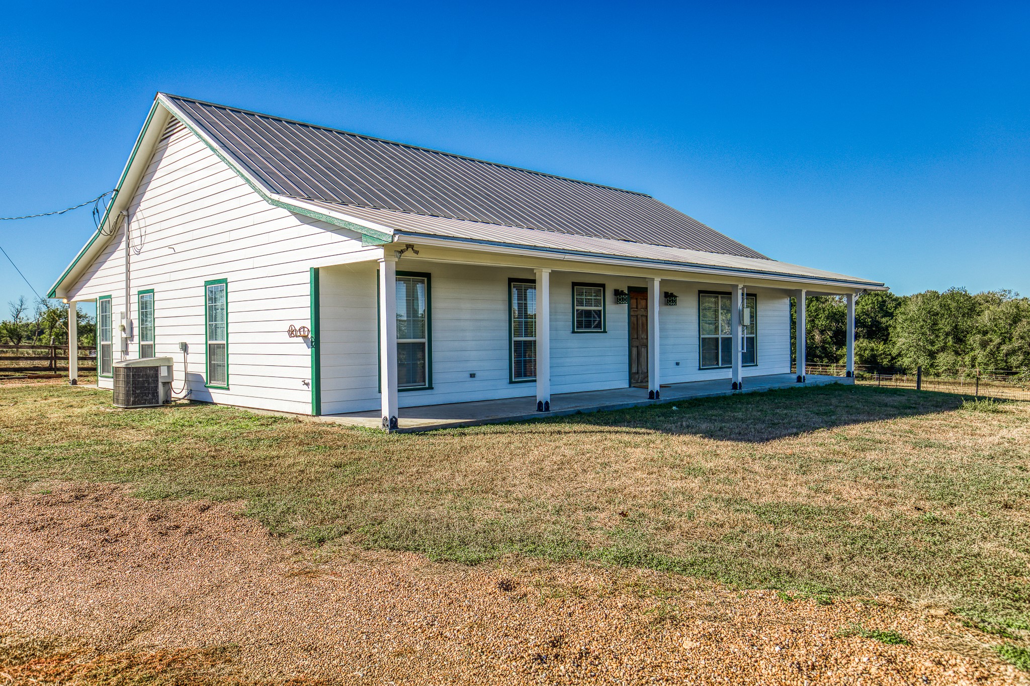 1712 Lynn Road Chappell Hill, TX 77426 - Photo 36 of 44 a front view of a house with a garden