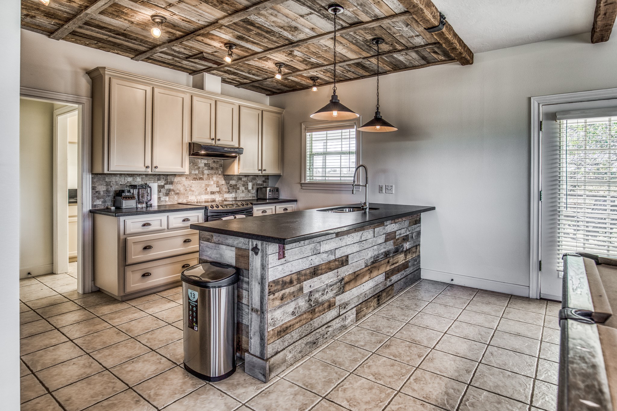 1712 Lynn Road Chappell Hill, TX 77426 - Photo 37 of 44 a kitchen with a sink cabinets and window