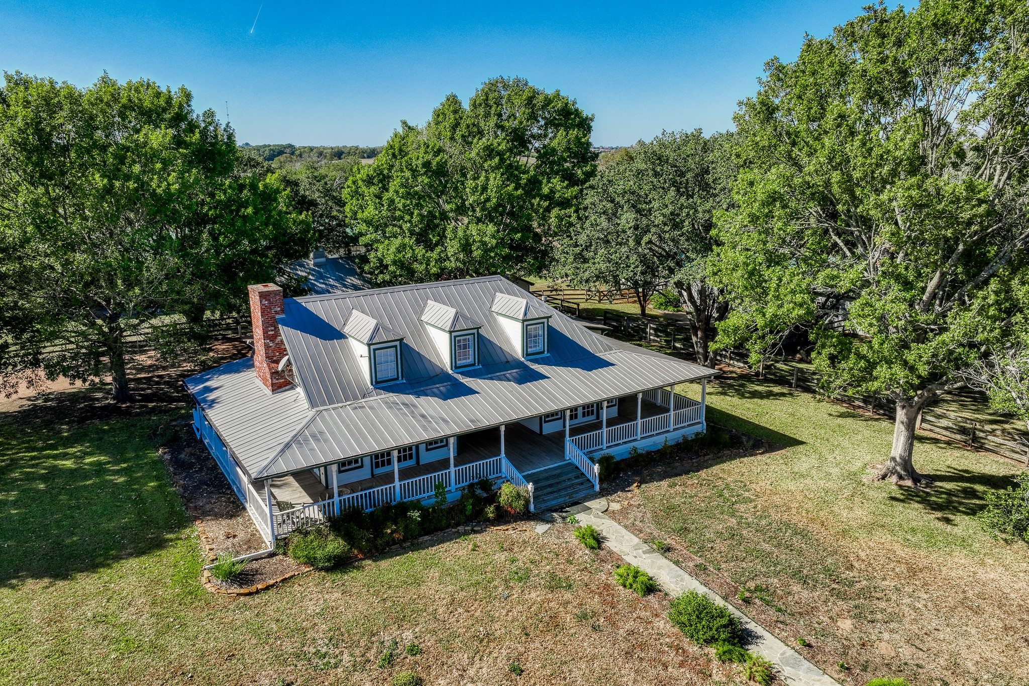 1712 Lynn Road Chappell Hill, TX 77426 - Photo 5 of 44 a view of a house with a yard deck and furniture
