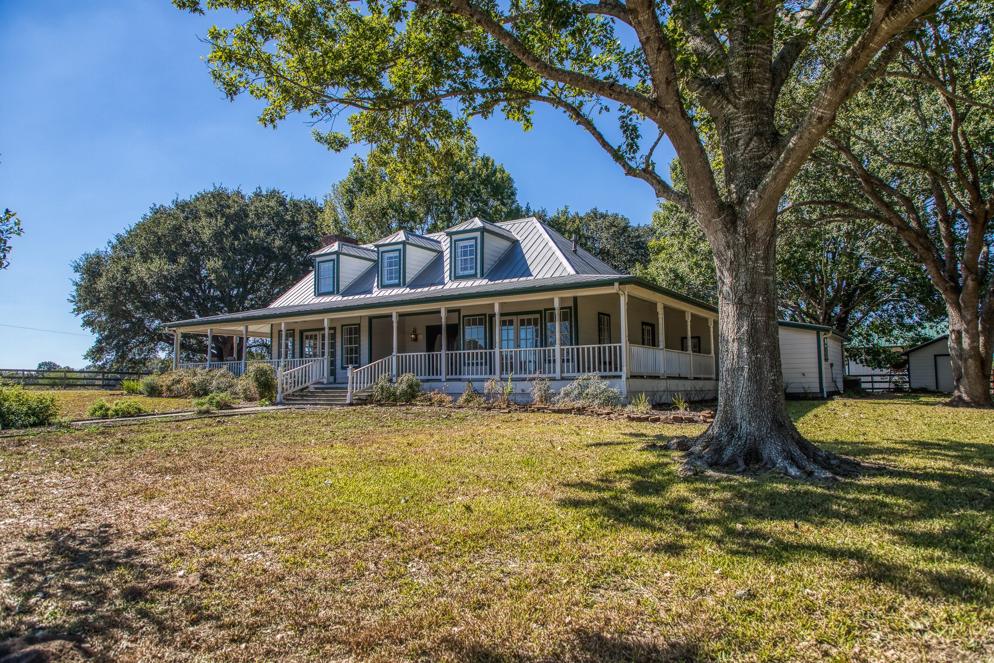 1712 Lynn Road Chappell Hill, TX 77426 - Photo 6 of 44 a front view of house with yard and trees in the background