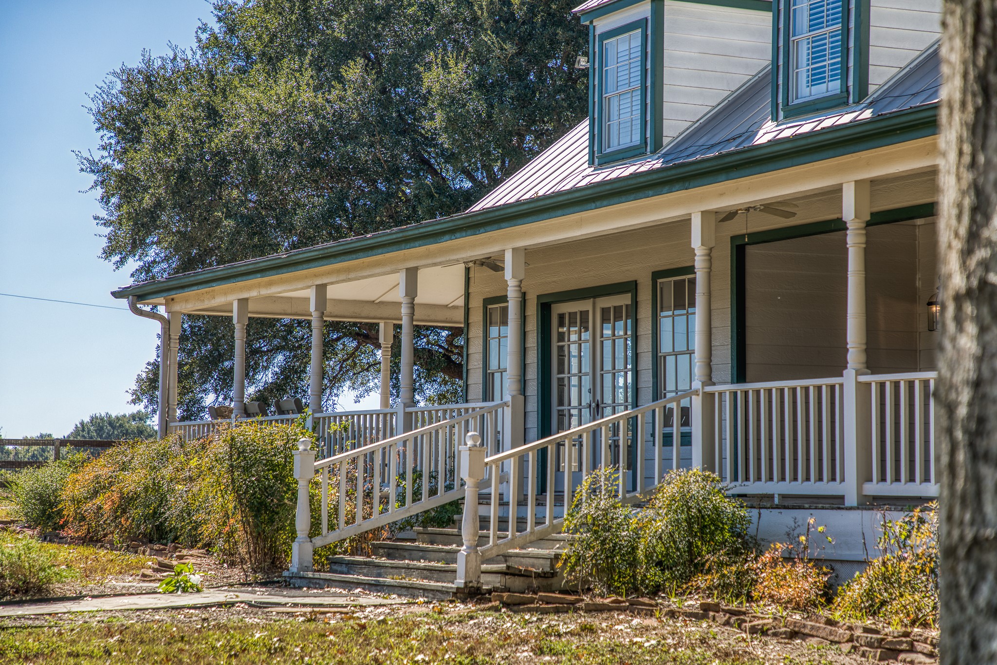1712 Lynn Road Chappell Hill, TX 77426 - Photo 7 of 44 a view of a house with a small yard and wooden floor and fence