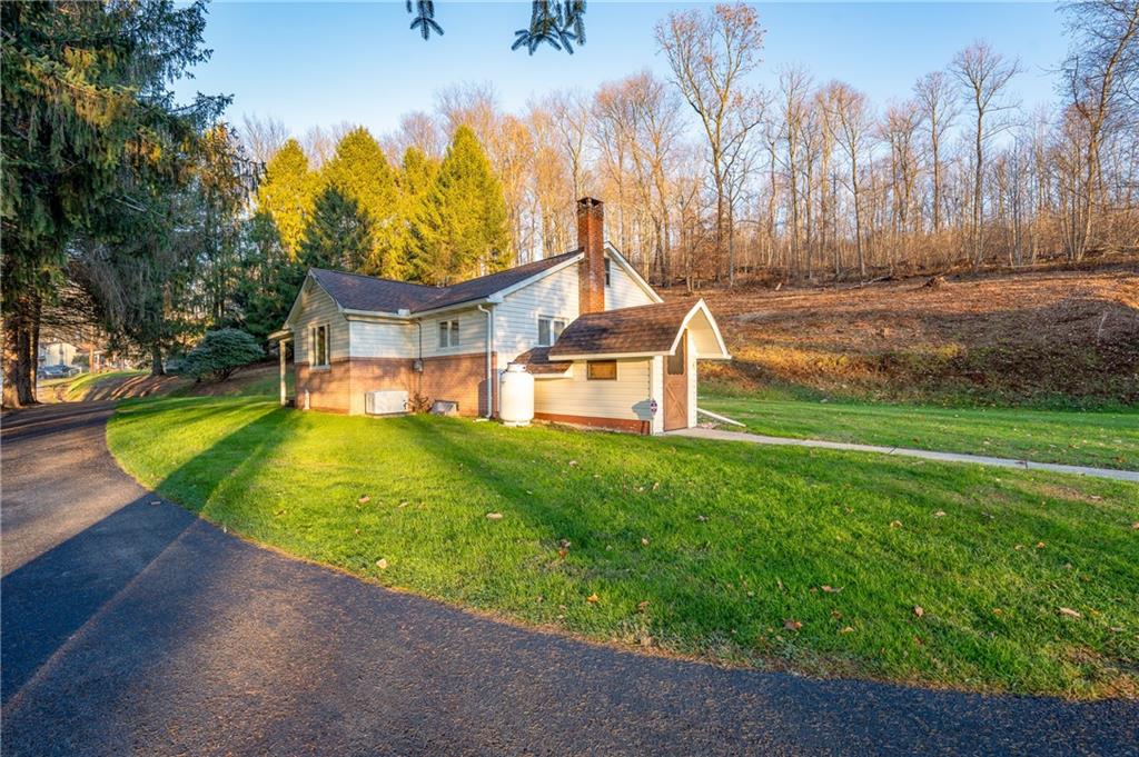 185 Foster Road Saltsburg, PA 15681 - Photo 33 of 42 a view of a house with pool and a yard
