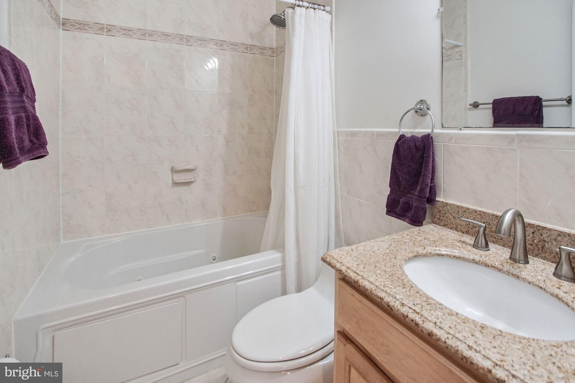 1437 Spring Road Northwest, Unit 24 Washington, DC 20010 - Photo 13 of 24 Bathroom with spa tub/shower