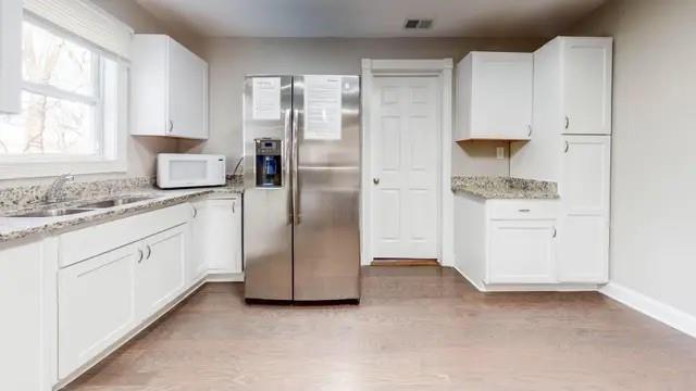 2164 Bouldercrest Road Atlanta, GA 30316 - Photo 5 of 11 a kitchen with a refrigerator sink and cabinets