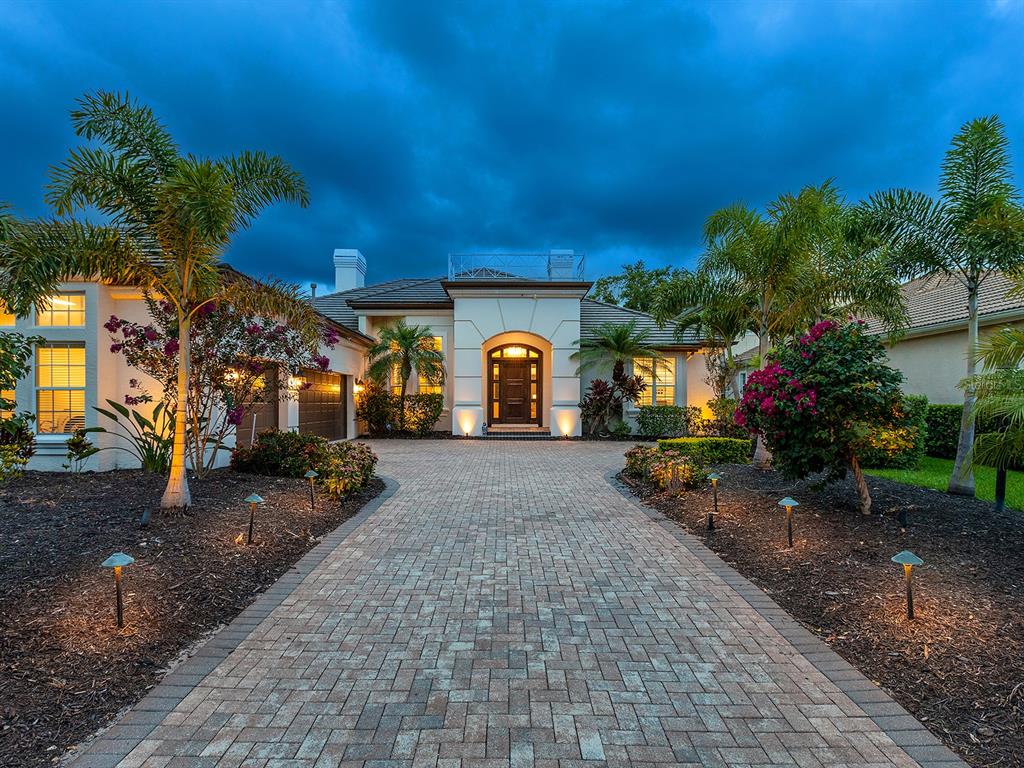 7431 Greystone Street Lakewood Ranch, FL 34202 - Photo 85 of 85 a view of a patio with table and chairs and potted plants