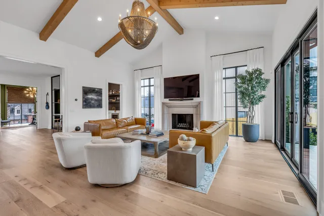 a large kitchen with kitchen island a island a sink a stove and a refrigerator