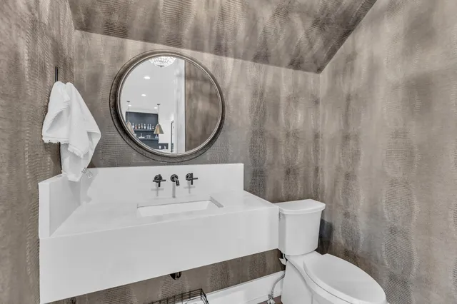 a view of swimming pool with outdoor seating and city view