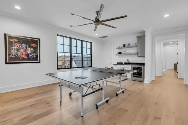 a view of a house with swimming pool and sitting area