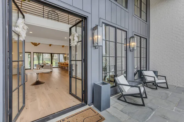 a living room with fireplace furniture and a flat screen tv