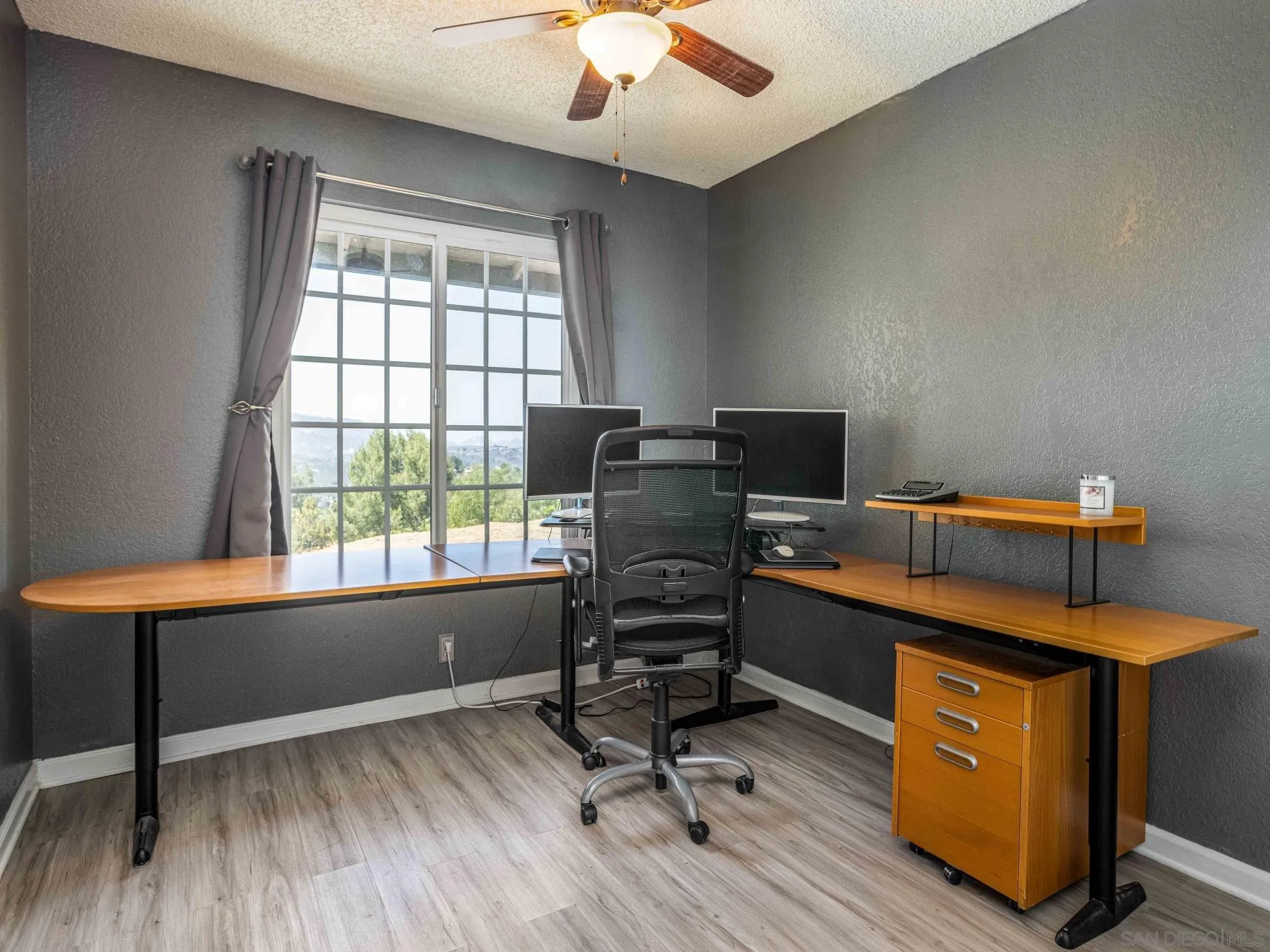 24392 Rutherford Road Ramona, CA 92065 - Photo 18 of 29 a view of workspace with wooden floor and windows