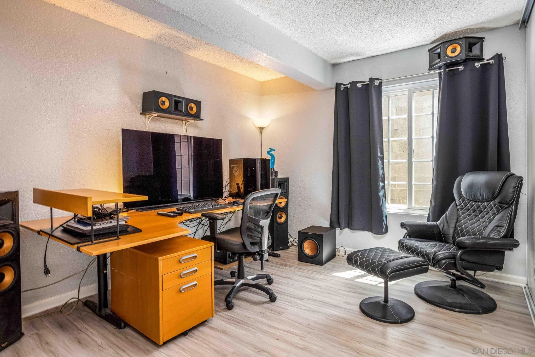 24392 Rutherford Road Ramona, CA 92065 - Photo 19 of 29 a view of a workspace with furniture and a window