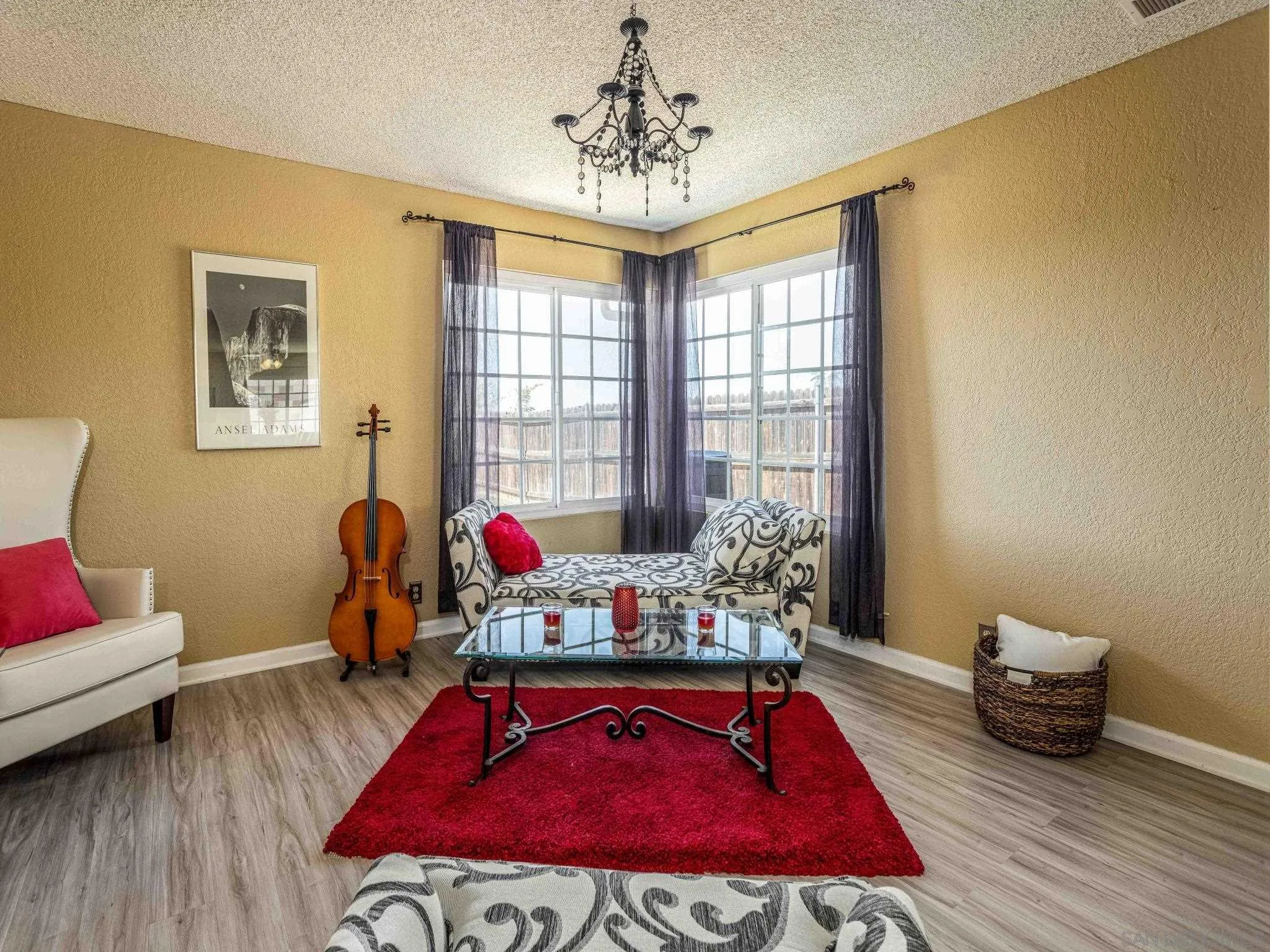 24392 Rutherford Road Ramona, CA 92065 - Photo 7 of 29 a living room with furniture and a wooden floor