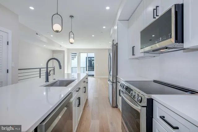 a kitchen with a sink and stove