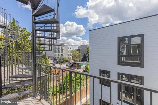 a view of a balcony with a tree