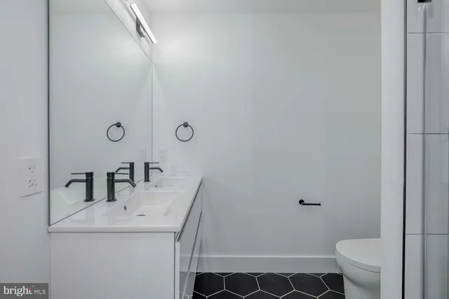 a bathroom with a sink and mirror
