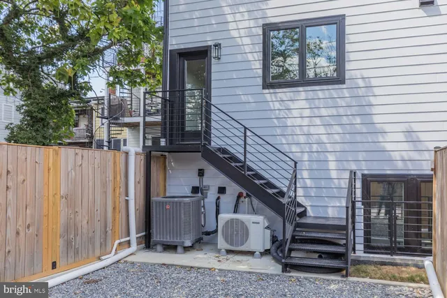 a view of a house with a tree